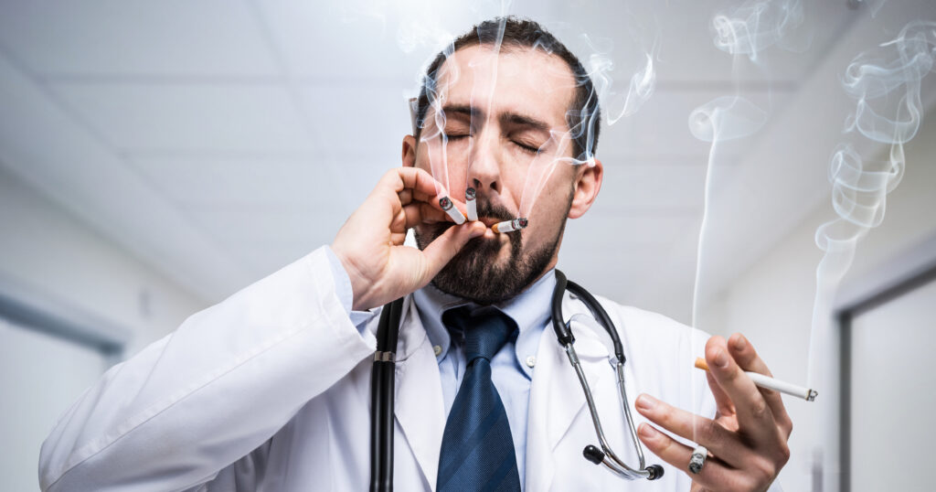 Nervous doctor smoking cigarettes